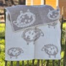 Wolldecke mit Schafmotiv beige natur